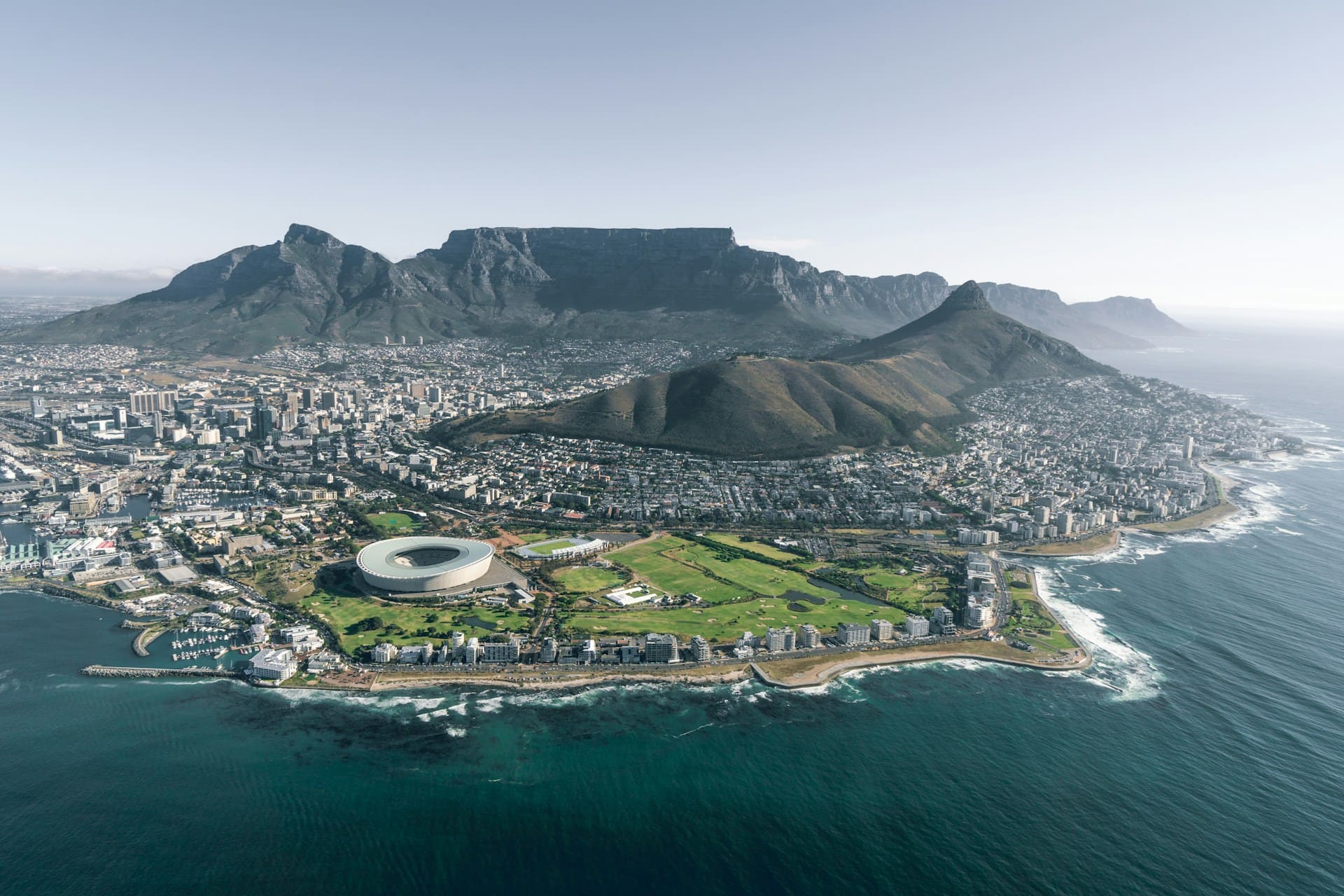 The Hottentots-Holland mountains at sunrise beyond the Cape Flats, seen from Signal Hill above Cape Town.